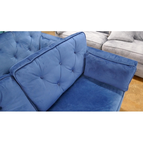 1546 - A Hoxton blue velvet three seater sofa - slight damage