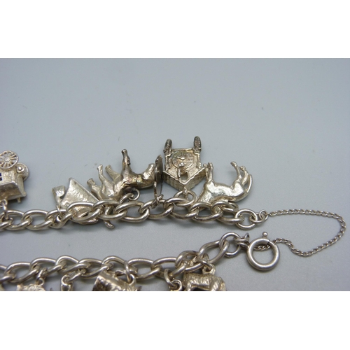 1007 - A silver charm bracelet, 44g