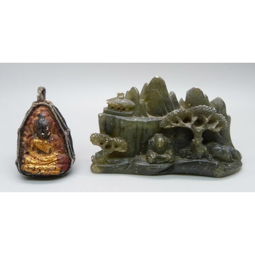 1061 - A Tibetan good luck charm and a carving depicting Buddha