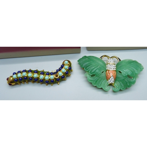 1062 - A Kenneth Jay Lane (KLJ) simulated jade butterfly brooch and a blue stone caterpillar brooch lacking... 