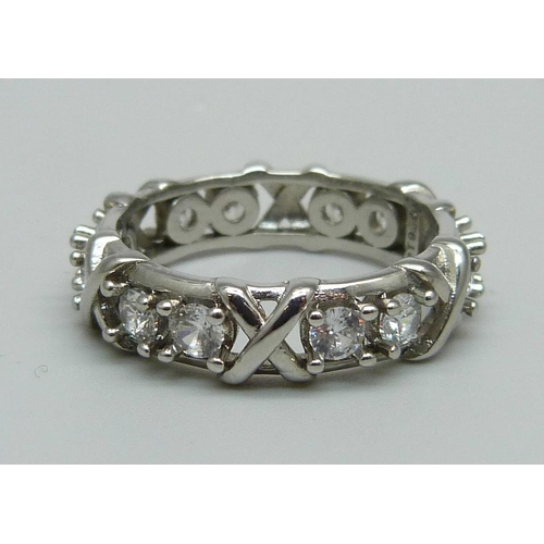 1064 - A white metal and crystal eternity ring, 3.9g, R, marked PT950