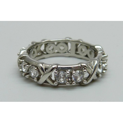 1064 - A white metal and crystal eternity ring, 3.9g, R, marked PT950