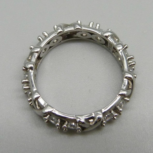 1064 - A white metal and crystal eternity ring, 3.9g, R, marked PT950