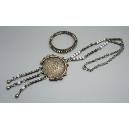 1078 - An Eastern white metal bangle and an Eastern necklace