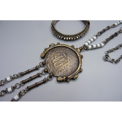 1078 - An Eastern white metal bangle and an Eastern necklace