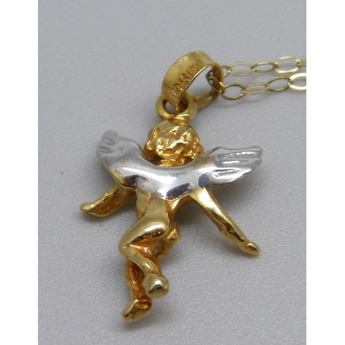 1086 - A 14ct gold cherub pendant on a fine 9ct gold chain, 2.1g