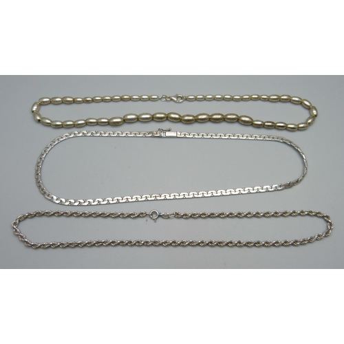 1087 - A silver bead necklace and two silver chains, 42g