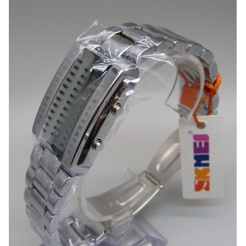 1088 - A Skmei illuminated binary wristwatch, boxed