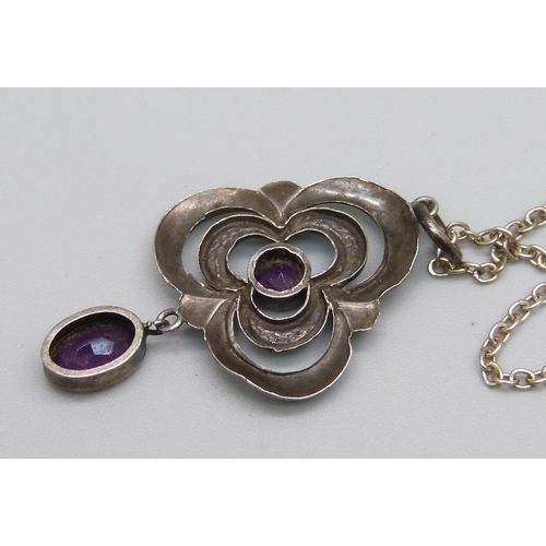 1092 - An Art Nouveau white metal and enamel pendant with amethyst drop-on silver chain