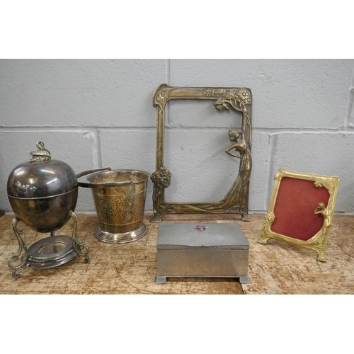 1131 - Two Art Nouveau style photograph frames, a Mappin & Webb plated egg warmer, a plated bottle cooler a... 