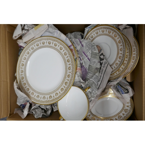 1156 - A Staffordshiare Gold Victoria dinner service; two large serving dishes, a gravy boat, six soup bowl... 