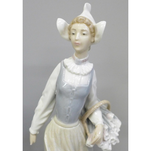 601 - Two Lladro figures, both a/f, a Lladro figure of mother duck and ducklings and a Nao figure of a cho... 