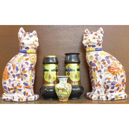 602 - A pair of Imari cats, two Bretby Art Nouveau vases (one a/f, restored), and a small hand painted vas... 