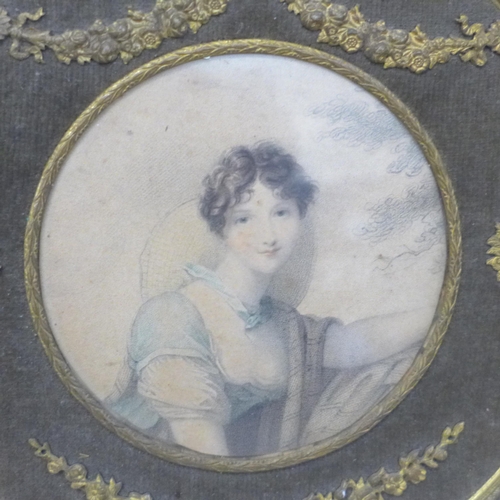 604 - A 19th Century half portrait watercolour of a Regency lady in an ebonised frame, one other engraving... 