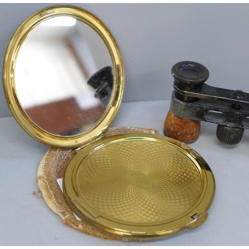 616 - A pair of opera glasses and a shagreen covered compact