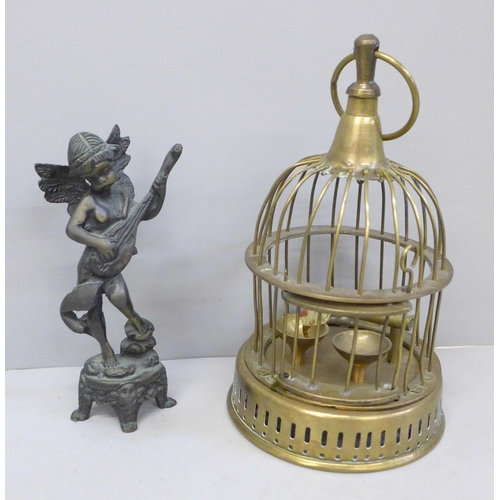 630 - A brass bird cage and a bronze figure of a cherub playing a mandolin