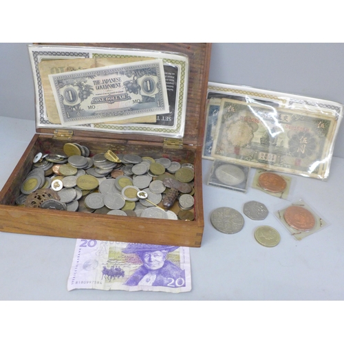 668 - A collection of coins and pins and foreign bank notes in Vosene Shampoo promotional packaging