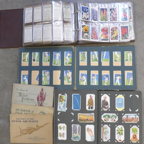 670 - Three albums and three booklets of cigarette cards including John Player, Wills, etc.