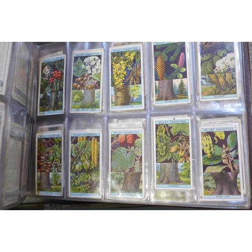 670 - Three albums and three booklets of cigarette cards including John Player, Wills, etc.