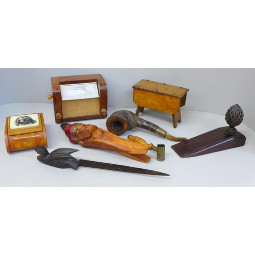 675 - Wooden items including a vintage shot measure, doorstop, pipe, etc.