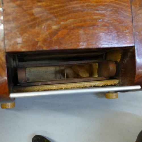 675 - Wooden items including a vintage shot measure, doorstop, pipe, etc.