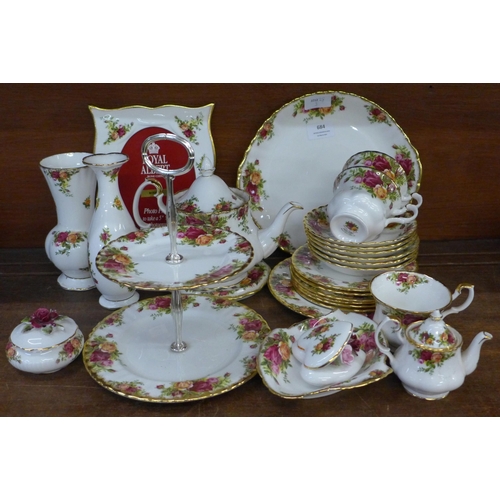 684 - A collection of Royal Albert Old Country Roses, part tea set, picture frame, cake stand, etc., one v... 