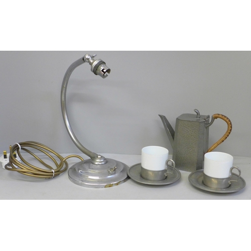 689 - Two Limoges coffee cans with pewter holders and saucers marked Etain France, an Art Deco table lamp ... 