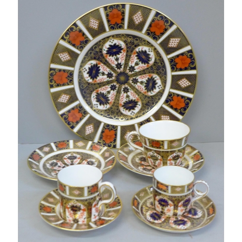 698 - Royal Crown Derby 1128 pattern china; dinner plate, three various cups and four saucers