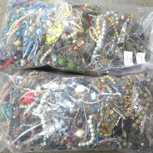 713 - Two bags of costume jewellery