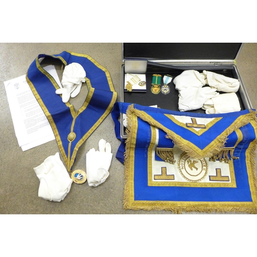 717 - A briefcase with Masonic apron and gloves, a box of Masonic Trust medallions (Nottinghamshire)