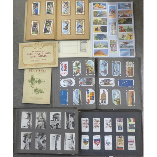 756 - A collection of cigarette cards albums including John Player, Wills, etc. (7)