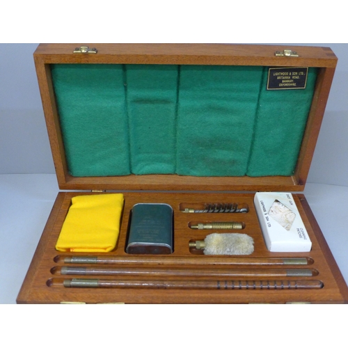 759 - A 12-bore shot gun cleaning kit, cased