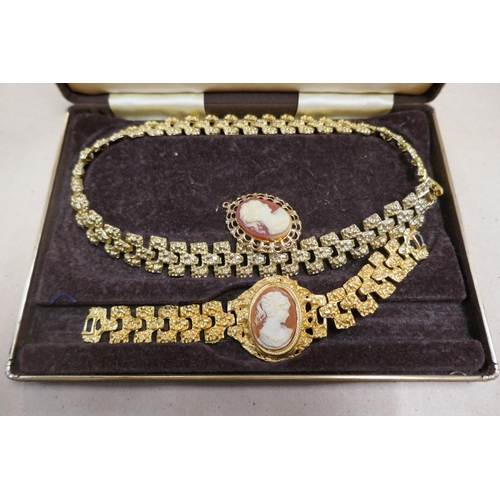 779 - A box of mixed fashion wristwatches and a lady's cameo jewellery set