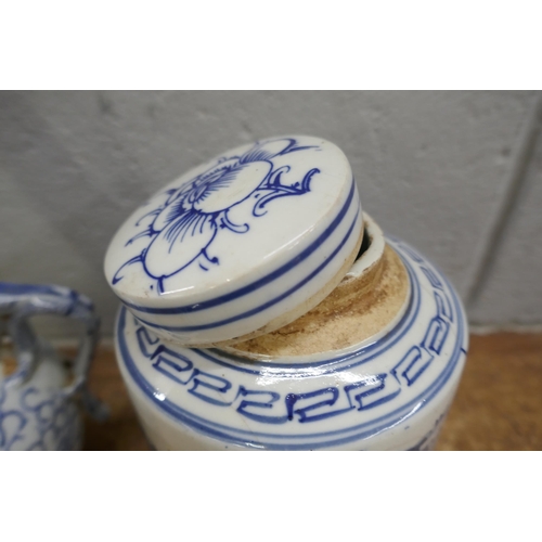 796 - Three items of Chinese blue and white pottery; cylindrical tea caddy, a/f, tea pot and small lidded ... 