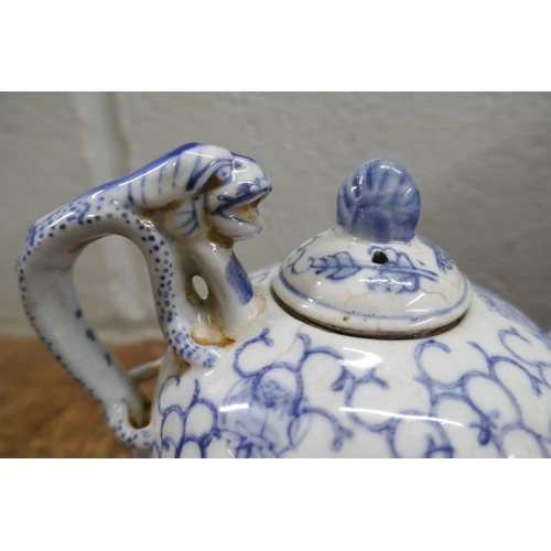 796 - Three items of Chinese blue and white pottery; cylindrical tea caddy, a/f, tea pot and small lidded ... 