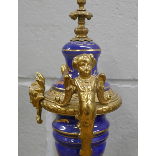 799 - A French Sèvres style three piece gilt bronze and porcelain clock garniture, with decorative ceramic... 