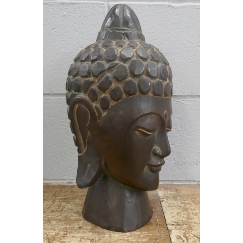 807 - A hand carved wooden head of Buddha, 41cm