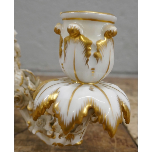 814 - A pair of porcelain candelabra tops