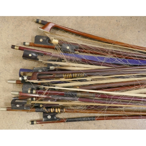 819 - A collection of violin and cello bows, one marked Penzel and one marked Japan