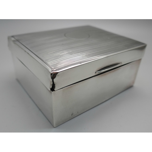 831 - A silver cigarette box with engine turned decoration to lid, gross weight 247g, a/f (lid)