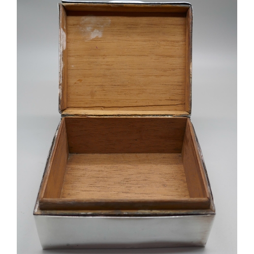 831 - A silver cigarette box with engine turned decoration to lid, gross weight 247g, a/f (lid)