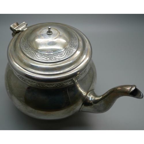 834 - A silver teapot, lacking handle, 619g