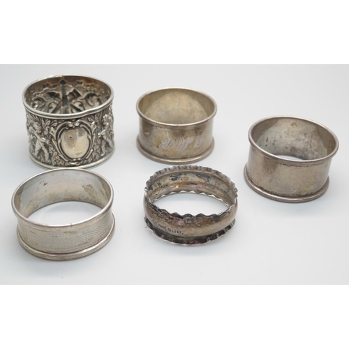 849 - Five silver napkin rings, one pair and three others, 65g