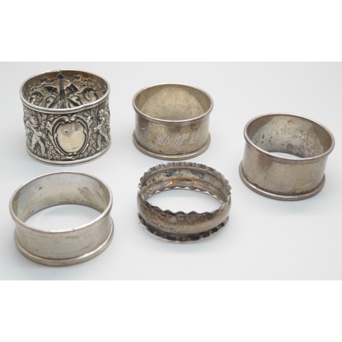 849 - Five silver napkin rings, one pair and three others, 65g