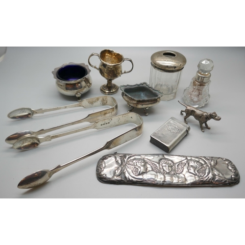 855 - Two pairs of Victorian silver sugar bows, two silver salts, a small silver trophy, a vesta case, a m... 