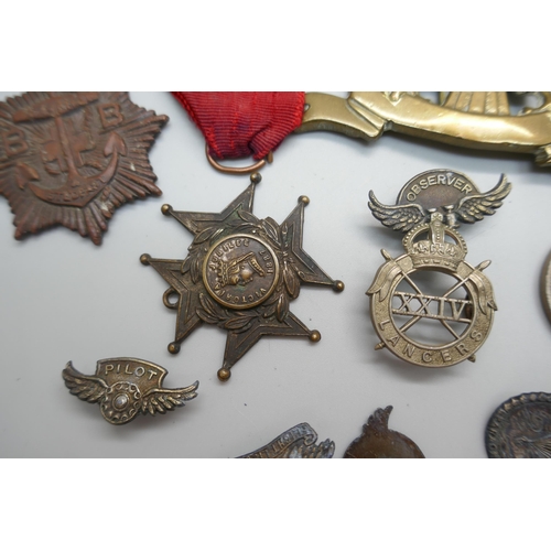 856 - A collection of military badges, etc.