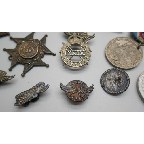 856 - A collection of military badges, etc.