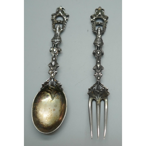 857 - An ornate German caste silver spoon and fork, 46g