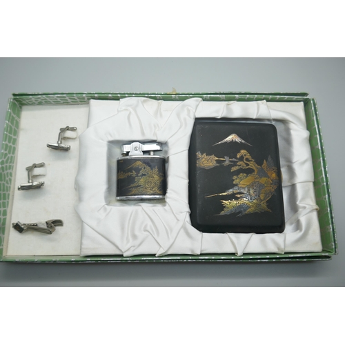 879 - A Japanese Damascene cigarette case and lighter set