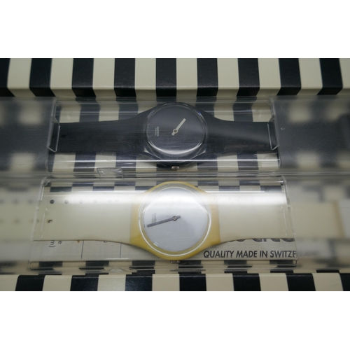 890A - A pair of Swatch wristwatches, 1996 with white hours and black minutes